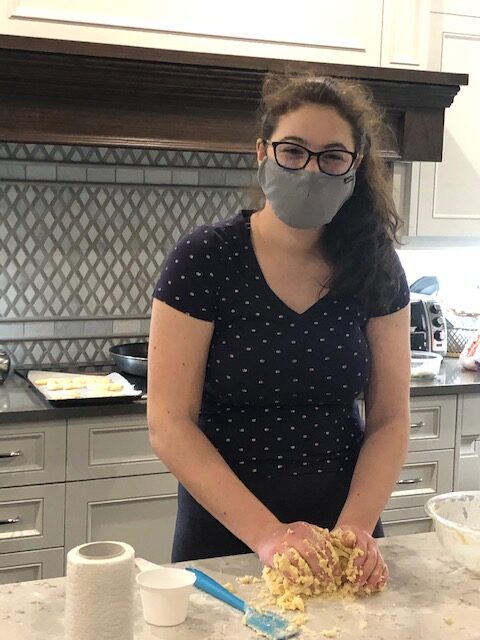 A Pound of Butter Bakery founder Lindsey Bareich photographed rolling cookie dough in 2021 (15 years of age).